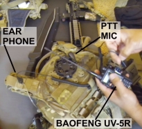 California militant showing loadout gear with Baofeng UV-5R with earphone and PTT microphone accessory set