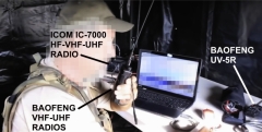 Florida militant radio operator at field exercise in command tent with Icom IC-7000 HF-VHF-UHF and Baofeng radios