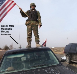 Militant at end of Oregon 2016 standoff waves flag on truck with CB magnetic mount antenna