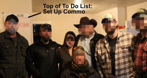 Oregon 2016 standoff militants pause for a group photo taken in the first few days of the standoff. Their To Do List board on the wall has SET UP COMMO as the first action item, showing their emphasis on radio communications.